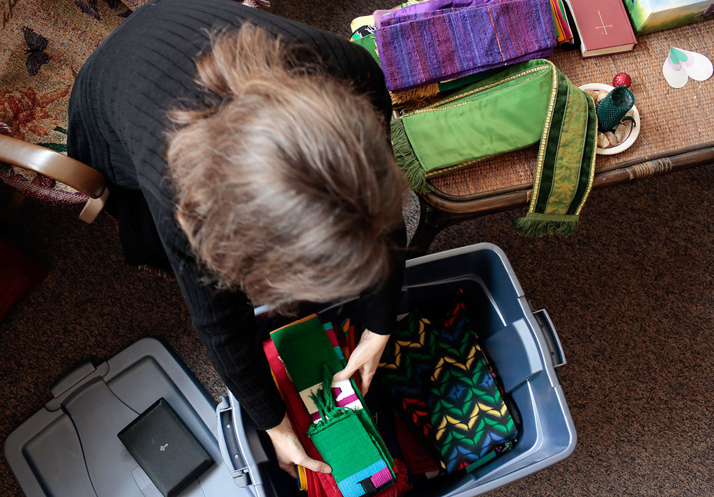 Cathy Rosenholtz packs up her stoles